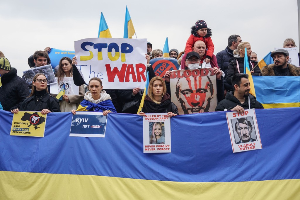 Demonstrators hold banners and flags of Ukraine during a demonstration against Russian aggression in Istanbul.