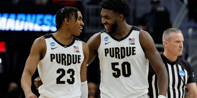 Purdue University's Jaden Ivey and Travon Williams celebrate during the second half of the second round of an NCAA college basketball game against Texas on Sunday, March 20, 2022, in Milwaukee.  Bordeaux won 81-71.