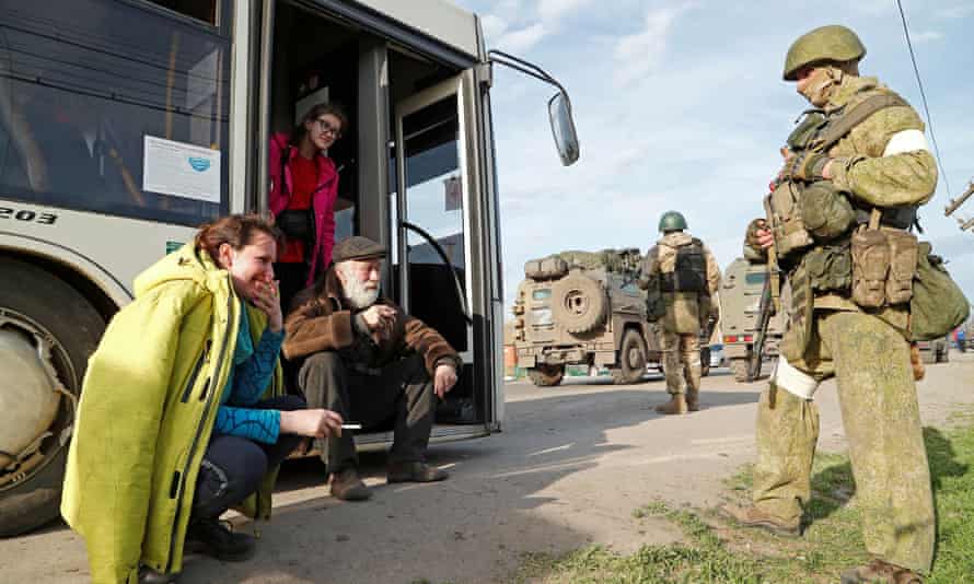 Natalia Usmanova with other evacuees near a temporary accommodation center in the village of Bizimeni in Donetsk.