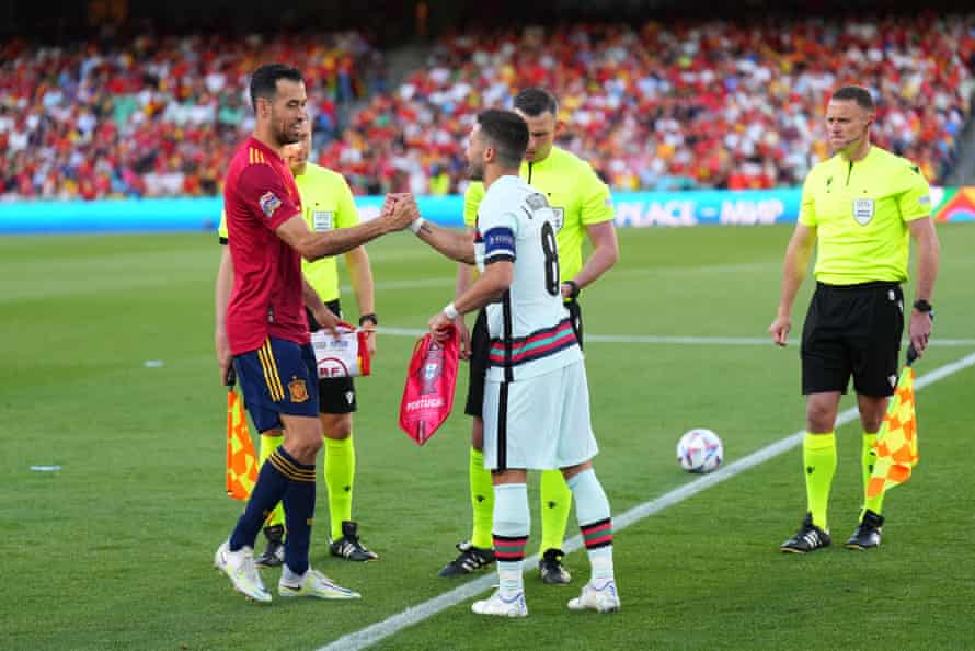 Old man Busquets and Joao Moutinho shake hands before kick-off.