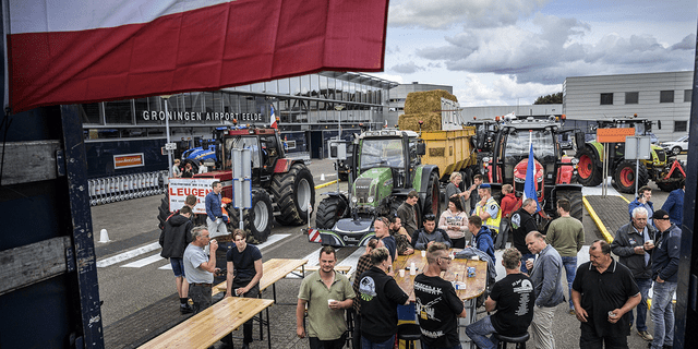 Farmers close the arrival and departure halls at Groningen Ede Airport in Eelde, the Netherlands, in protest of the government's far-reaching plans to cut nitrogen emissions on July 6, 2022.