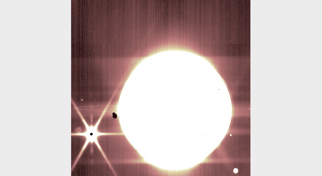 Jupiter and some of its moons are seen through the NIRCam 3.23-micron filter of the James Webb Space Telescope.