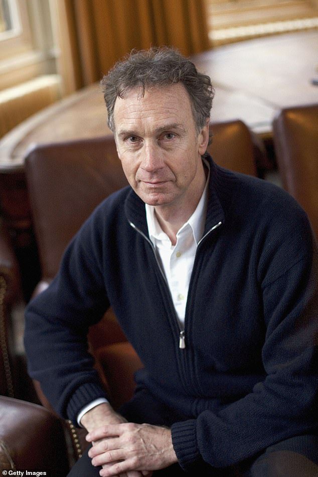 Evans poses for a photo at the annual Oxford Literary Festival at the Oxford Union in April 2005