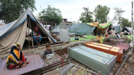 Residents take shelter in a makeshift camp in Rajanpur district, in Pakistan's Punjab province on August 24.