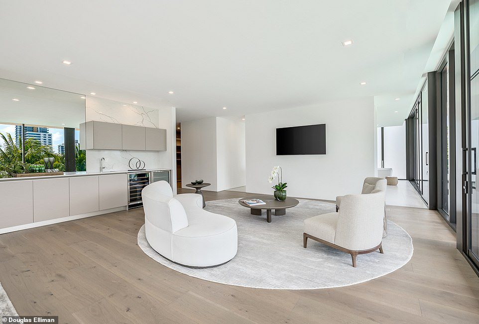 Modern: The multi-million dollar space has mainly white walls and light-colored wood floors to create a cheerful vibe.