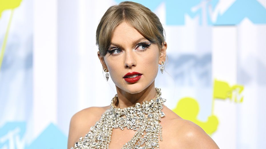 Taylor Swift standing at the MTV VMAs